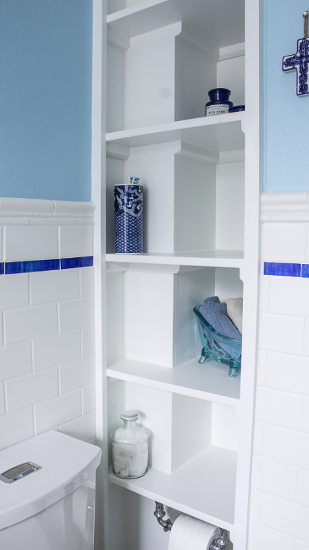 Open, recessed storage niches help a room feel wider and larger.
